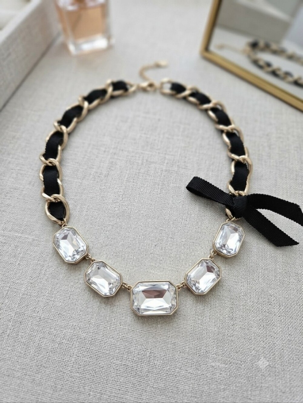 Gold-Tone Crystal Statement Necklace with Black Ribbon Accent